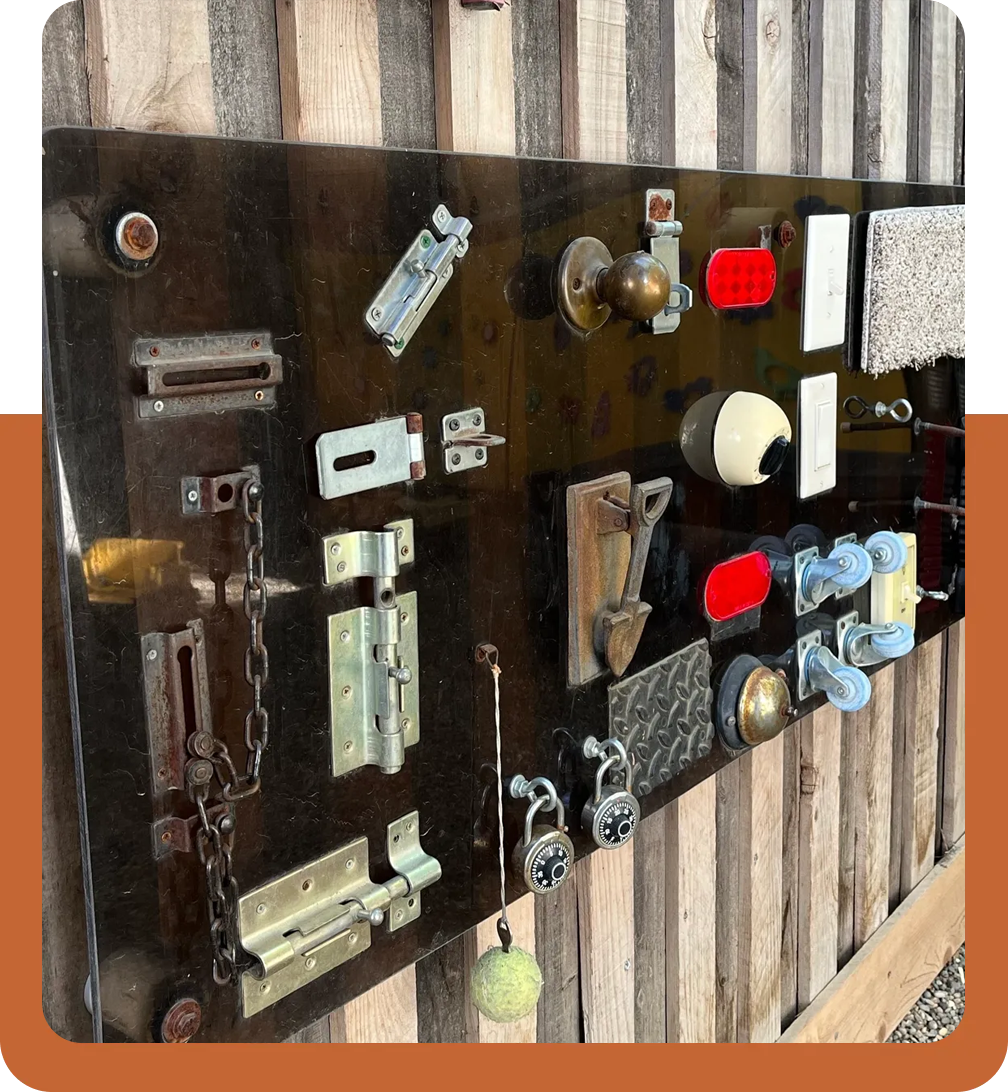 A wooden board with many different locks on it