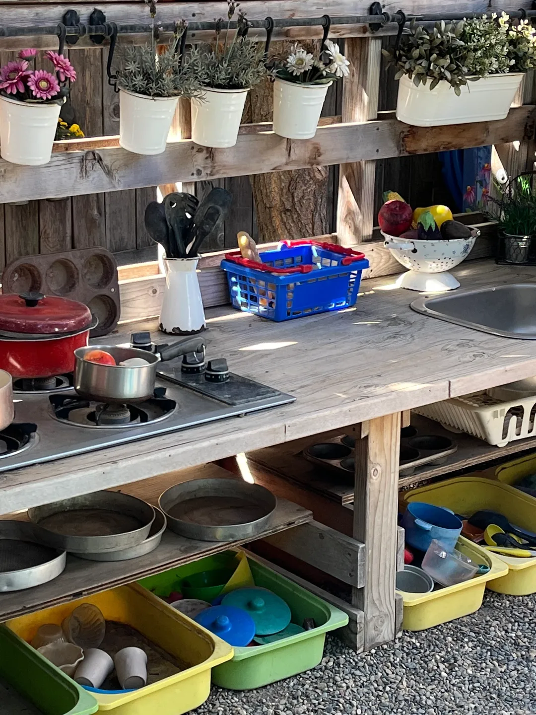 A wooden table with pots and pans on it.