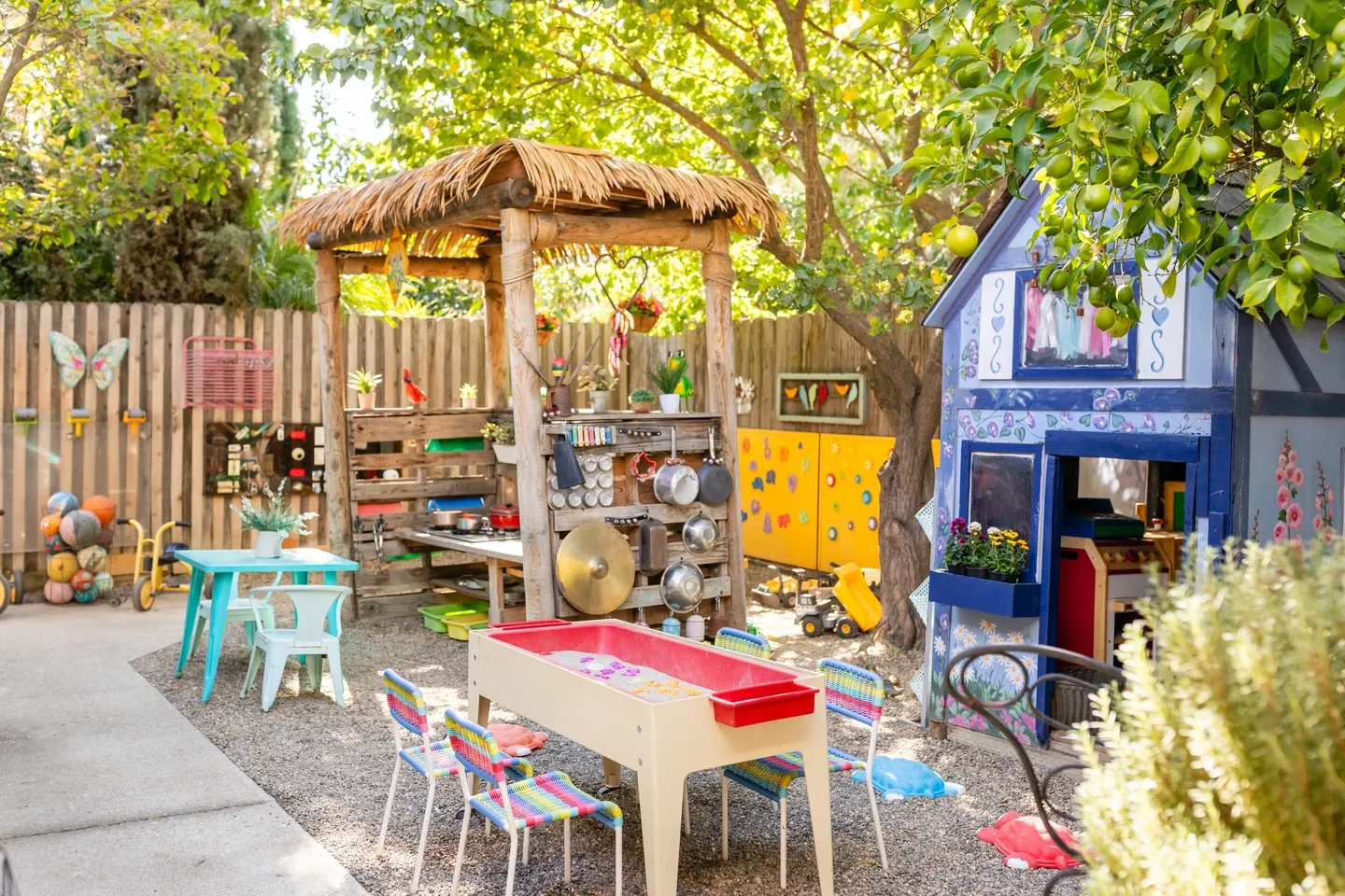 A group of tables and chairs in the yard.